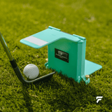 Yips Blocker with a wedge and golf ball on the practice green