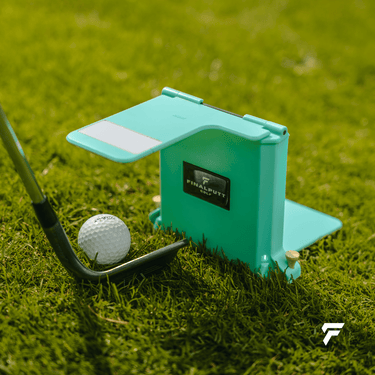 Yips Blocker with a wedge and golf ball on the practice green