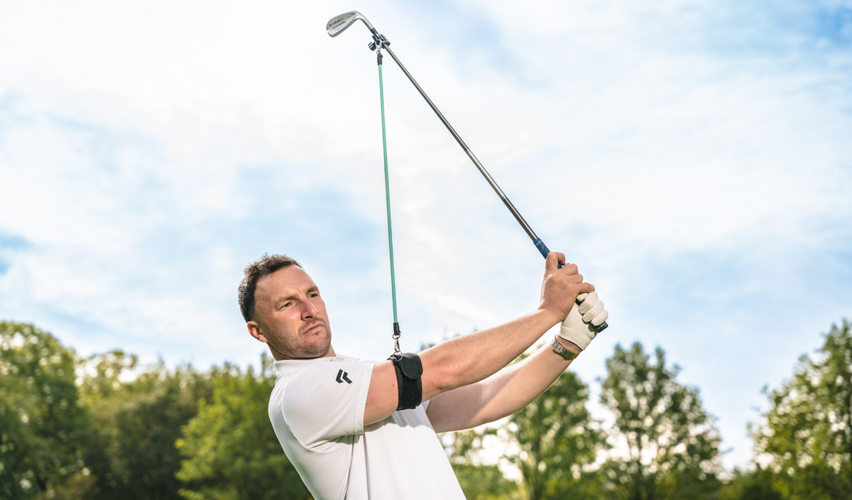 Golfer swinging with the FinalPutt Lag Trainer Pro